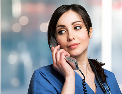 image of dental receptionist taking a phone call